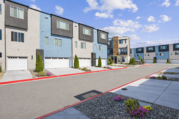 Modern townhome community street with attached garages